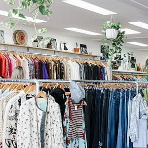 clothes rails and shelves in an organised charity shop