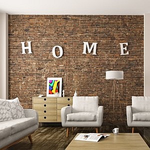bright decluttered organised sitting room with the letters HOME mounted on a brick feature wall