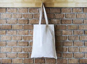 Caption Mock up Blank Cotton Tote Bag on Brick wall Background Hipster lifestyle Alt Text