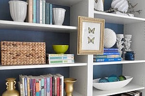 tidy organised decluttered shelves of books and ornaments