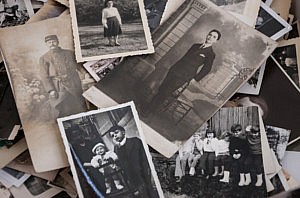 Pile of black and white photographs to be organised